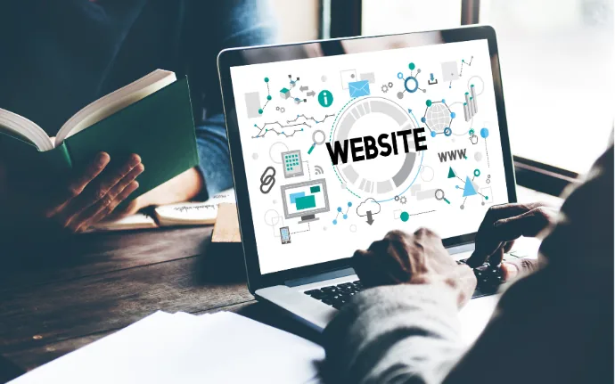 Laptop menampilkan ilustrasi website